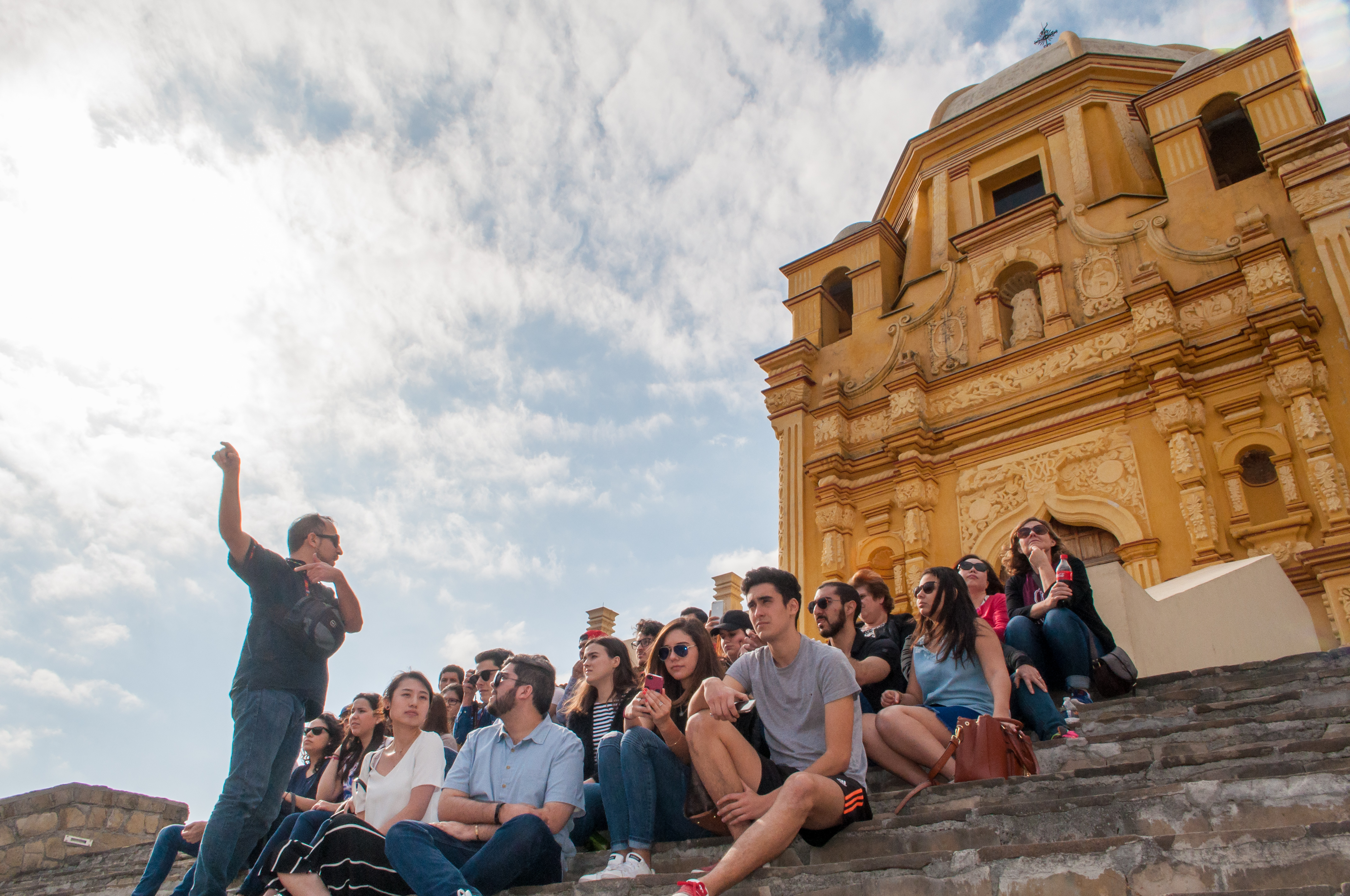Students take part in a class on cathedral steps in Monterrey, Mexico