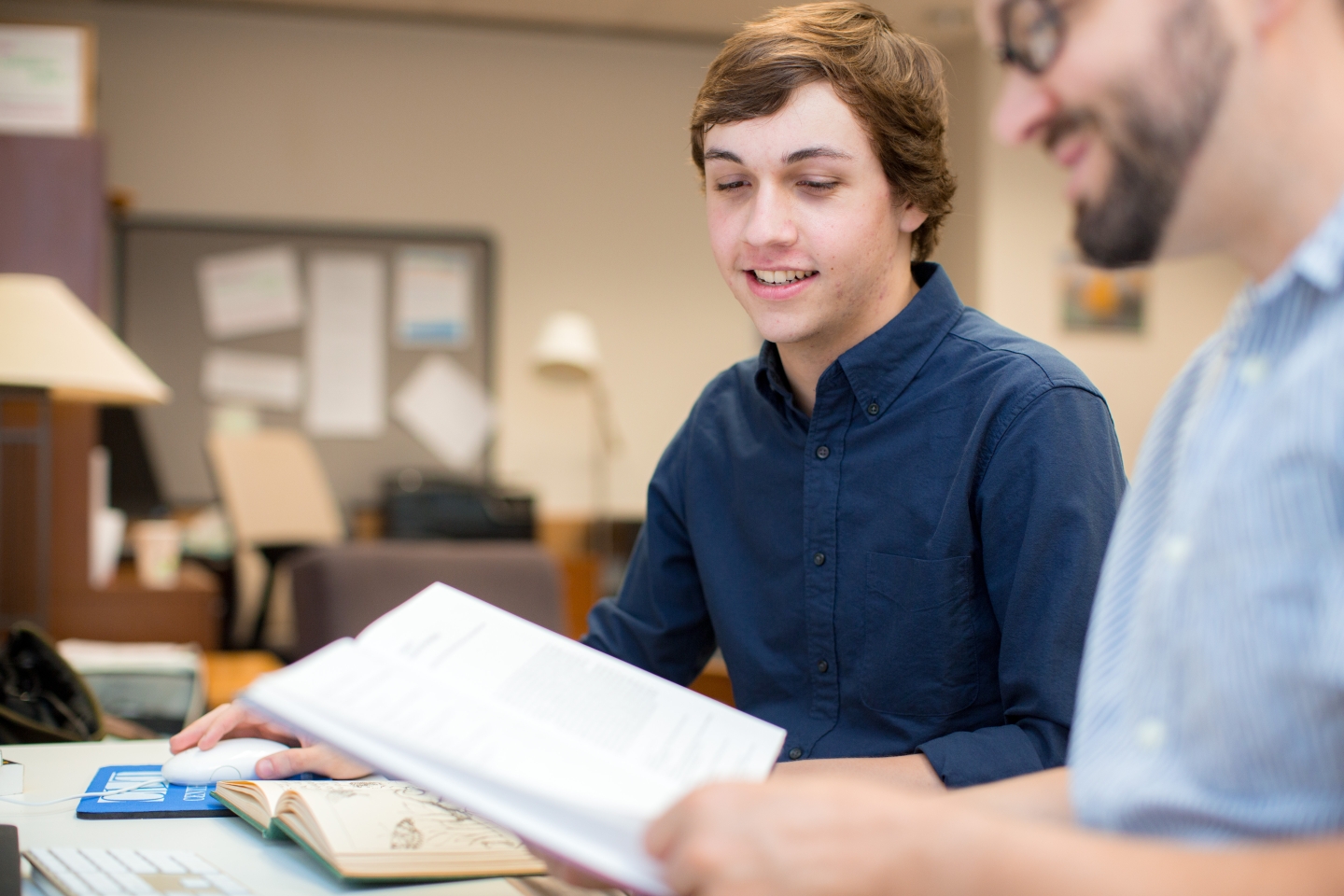 Two students discussing book
