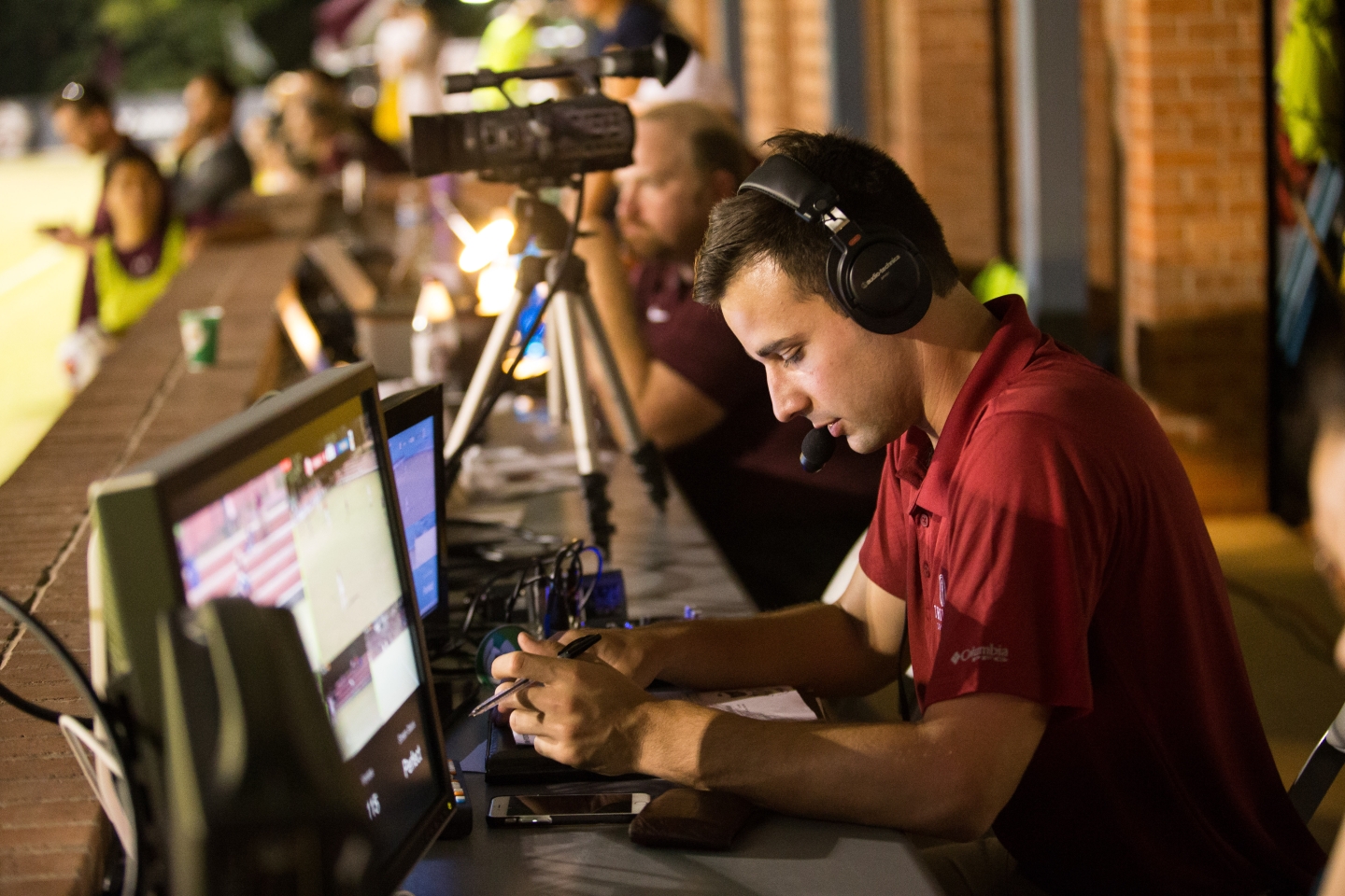 A student helps broadcast a soccer match