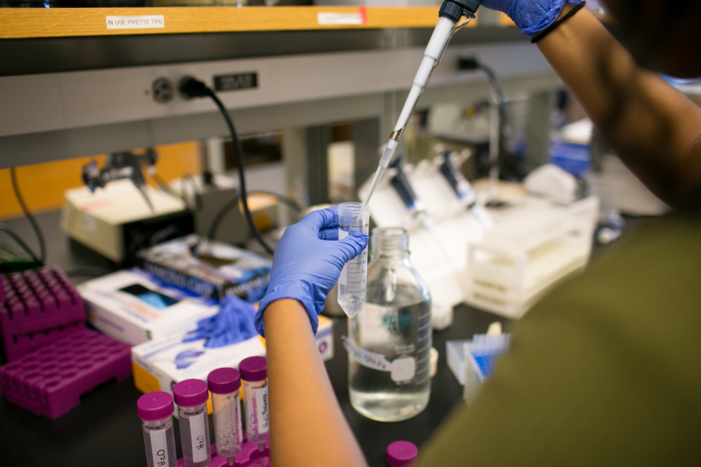 Student collects samples into a vial.