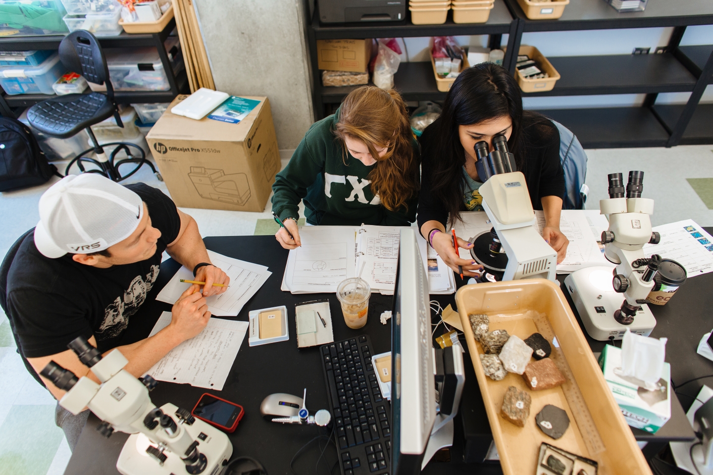 Group of three students in a geology lab