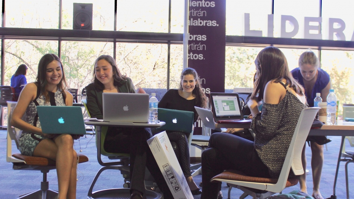 Students sitting in chairs talking