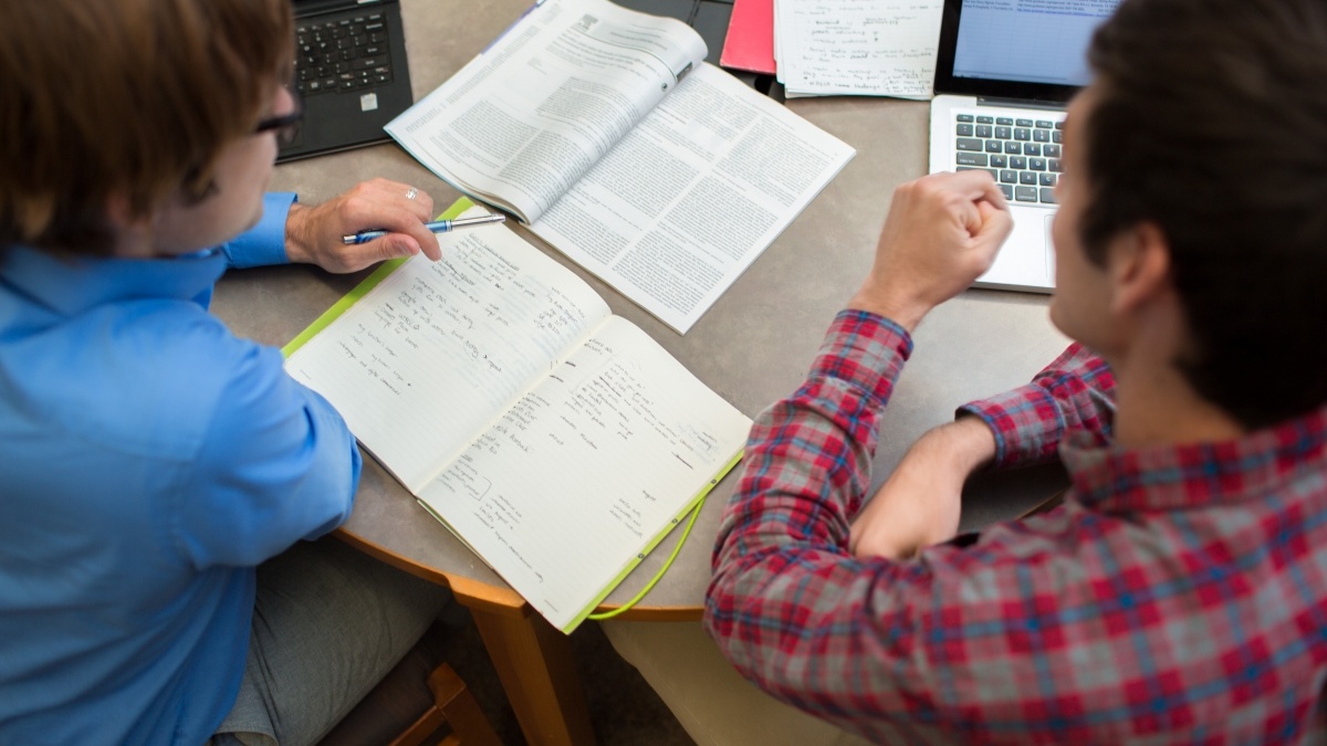 Two students discussing two books and comparing them
