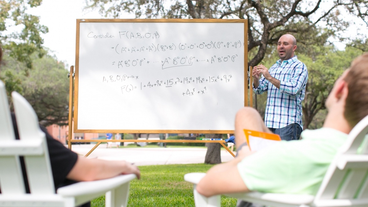 Professor Teaching Students Outdoors