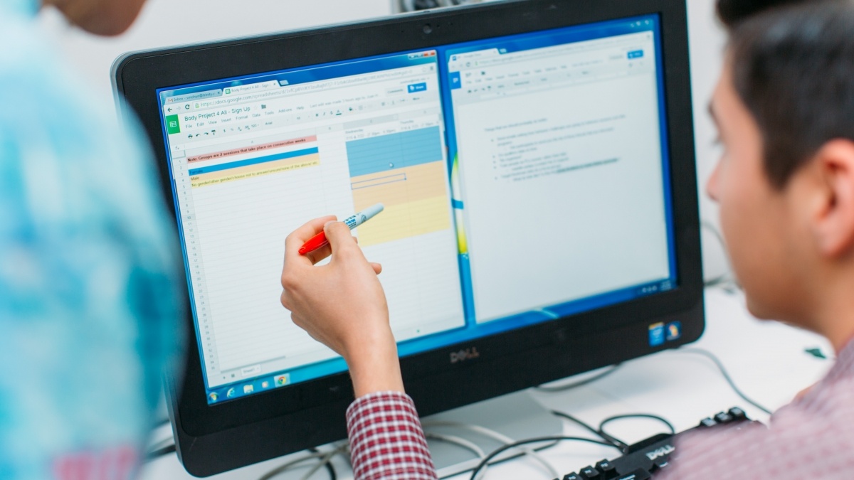 two people looking at computer screen