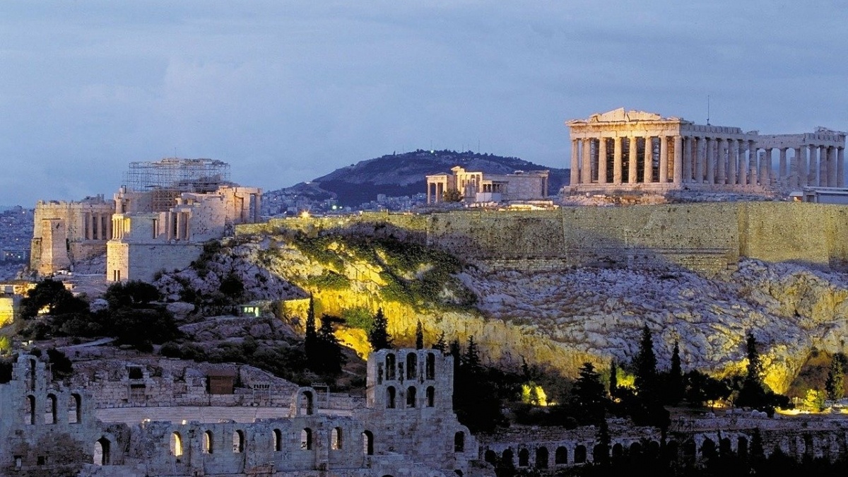 Aerial view of Athens, Greece at sunset with the Acropolis in the distance
