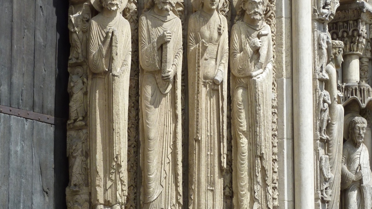 Carvings of figures on the side of a building